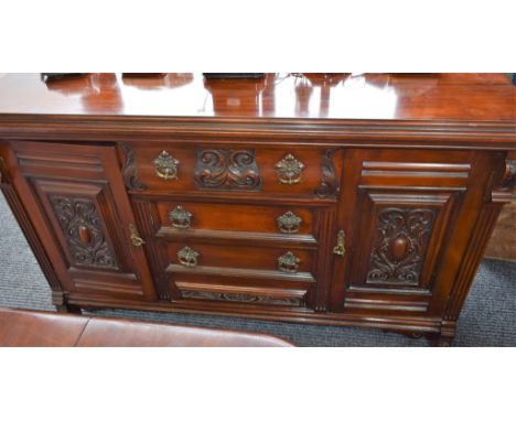 A Flemish inspired sideboard, moulded rectangular top above three central short drawers, flanked by a pair of panel doors app