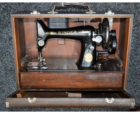 A Singer manual sewing machine, cased