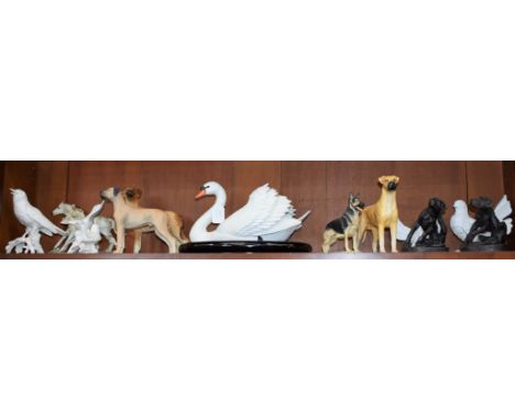 A Beswick model of a dog, Champion Ruler of Ouborough; a Franklin Mint model of a swan, 30cm wide, on oval base; other bird a