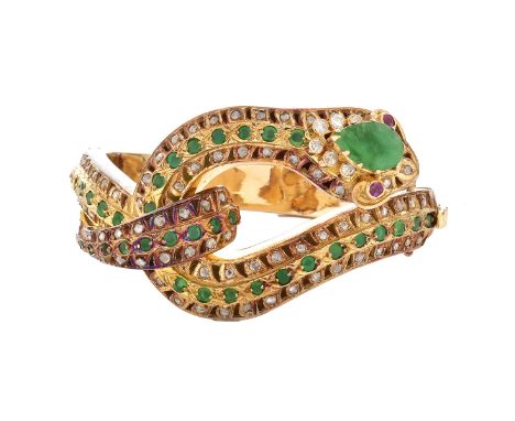 Vintage Emerald, Diamond and 14 Karat Yellow Gold Figural Snake Hinged Bangle Bracelet with Ruby Eyes. Set with a pear shape 