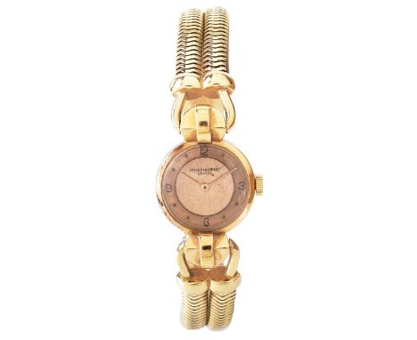 Lady's Vintage Patek Philippe 14 Karat Yellow Gold Bracelet Watch with Manual Movement. case measures 20mm. Signed, hallmarke