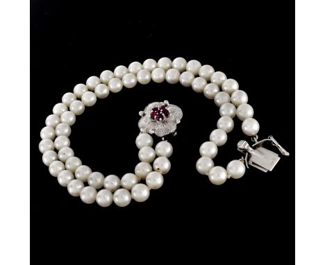Vintage Double Strand 4-5mm Pearl Bracelet with Ruby, .50 Carat Diamond and 14 Karat White Gold Clasp. Stamped 14K. Measures 