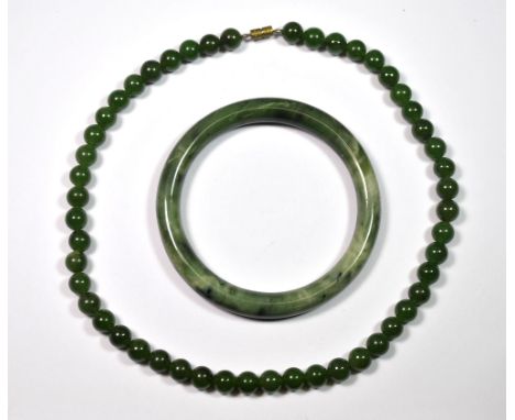 A single strand jade necklace and bangle.