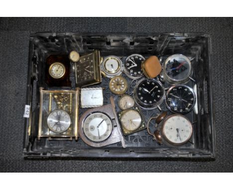 A box of mixed vintage clocks.