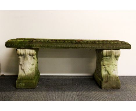 An old concrete garden bench.