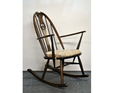 An Ercol swan back rocking chair.