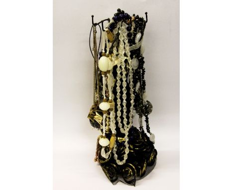 A stand of vintage necklaces etc.