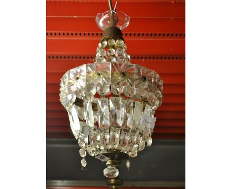 A gilt and crystal light fitting.