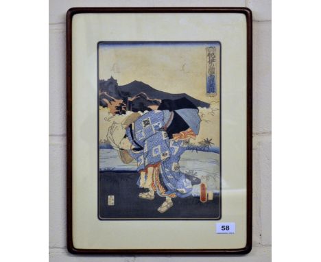 An early 19th century framed Japanese wood block print of a woman stooping to tie her shoelace, 38 x 50cm.