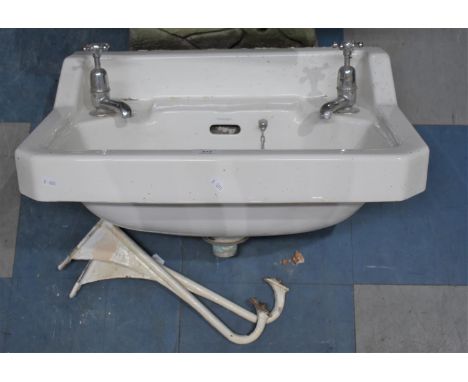 A Vintage White Glazed Pyramid Sink with Taps and Brackets, 56cm wide 