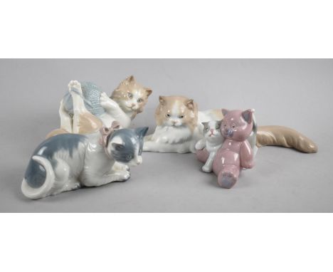 A Collection of Four Nao Cat Ornaments 