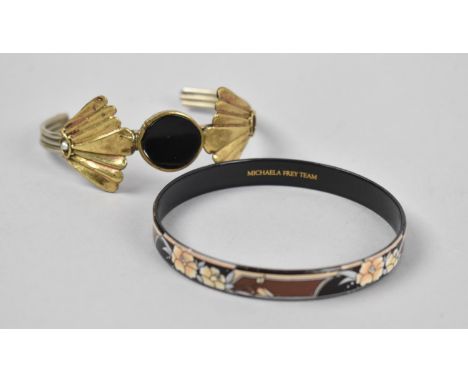 A Michaela Frey Enamel Bangle and a White and Gilt Metal Bangle 