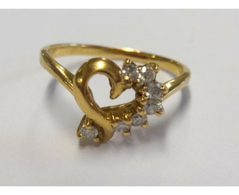 A gold heart and diamond ring, size G.