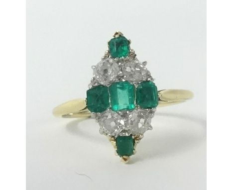 An emerald and diamond marquise ring set in yellow gold, unmarked, size P.