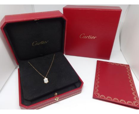 Cartier, an 18ct yellow gold necklace set with a mother of pearl set  pendant, purchased new 2009 with certificate, original 