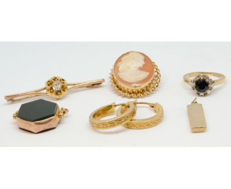 A 9ct gold Ingot, a pair of 9ct hoop earrings, a 9ct bar brooch, an 18ct sapphire cluster ring , an antique fob and 9ct cameo