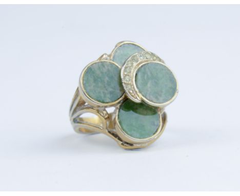 A large green hardstone and yellow gold tiered ring marked 14k, approx 9gms, size N.