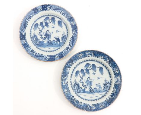Depicting Chinese figures under tree, flowers and butterflies on border, 29 cm. in diameter, chip.