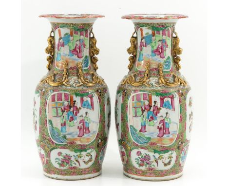 Depicting scenes with Chinese figures and flowers in Famille Rose and gilt enamels, temple lion handles, 44 cm. tall.