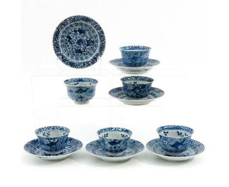 Blue and white floral decor, Kangxi mark, saucers are 13 cm. in diameter, chip.
