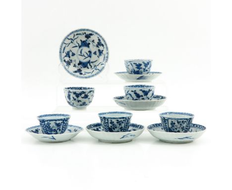 Blue and white floral decor, saucers are 7 cm. in diameter, chip and hairline.