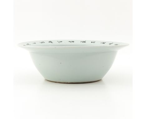 Decorated with flowers and bird in center of basin with Chinese text on rim, 30 cm. in diameter.