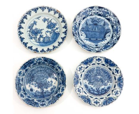 consisting of 4 saucers, Delft, 18th century, blue / white decor in underglaze, diameter 35 cm.