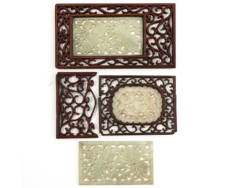 Including 2 in frame, one without frame, and a carved wood frame.   Largest jade sculpture measures 10 x 6 cm. excluding fram