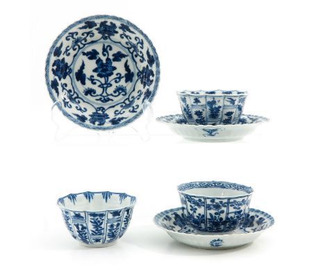 Blue and white floral decor, including double ring and jade mark, saucers are 13 cm. in diameter, chip and hairline.