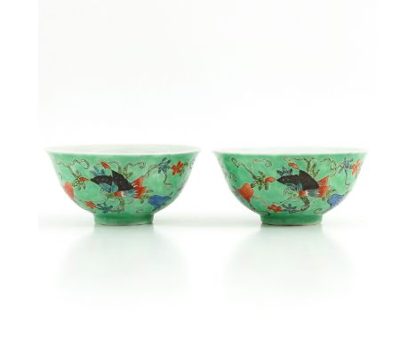 Light green ground decorated with butterflies and Chinese antiquities, Guangxu mark, 11 cm. in diameter. 