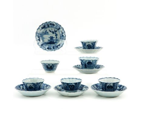 Depicting landscape scene in center with Chinese figures on border, saucers are 10 cm. in diameter, chip and hairline.