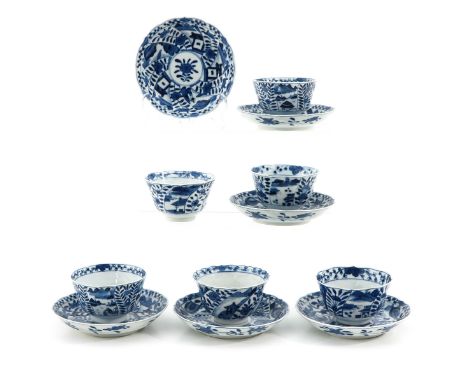 Blue and white floral deocr, including Qianlong mark, saucers are 13 cm. in diameter, chip and hairlline.