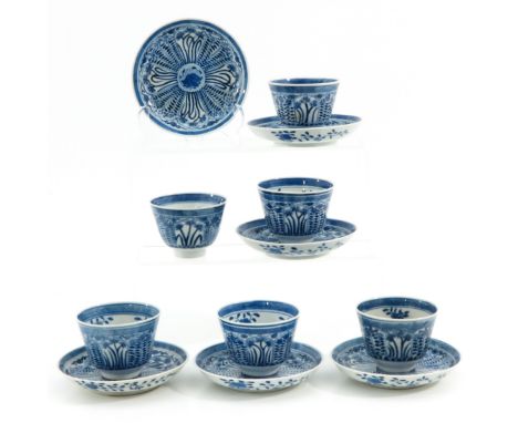 Blue and white floral decor, marked with double ring and jade symbol, saucers are 13 cm. in diameter, hairline.