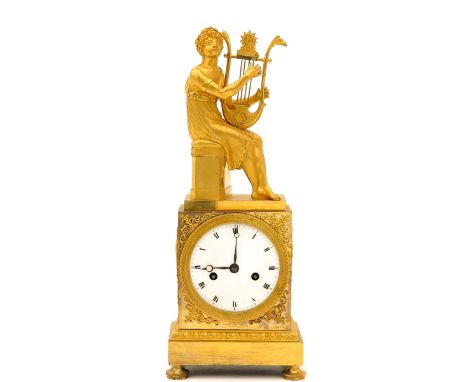 fire gilded, Empire period, ca.1810, with god playing lyre, height 39 cm.