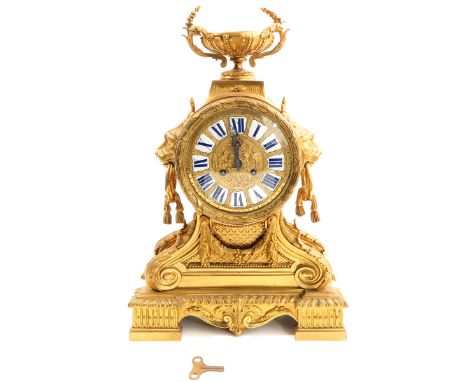 19th century, ormolu, with Roman numerals in enamel cartouches, height 59 cm.