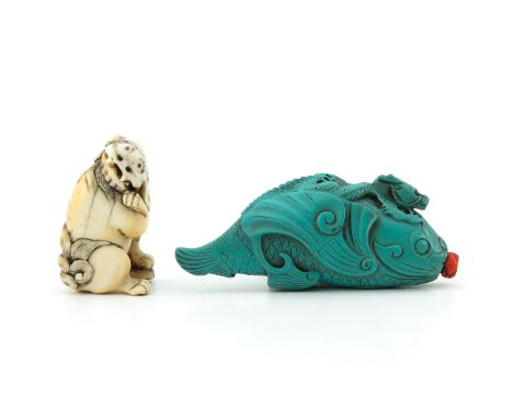 Carved turquoise snuff bottle in the form of a fish with dragon on back, red coral stopper. Provenance:  Bowen Auction, Markh