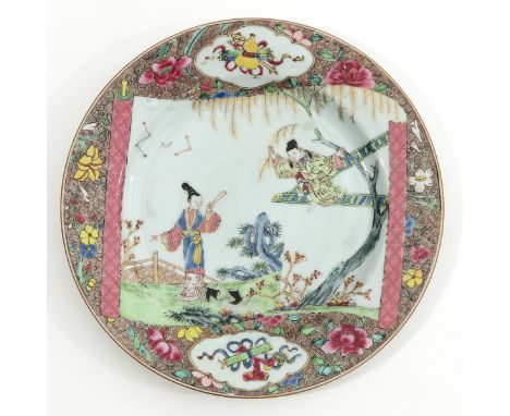 Depicting Chinese figures in garden in Famille Rose and gilt enamels on scroll decor, floral border, 23 cm. in diameter. 