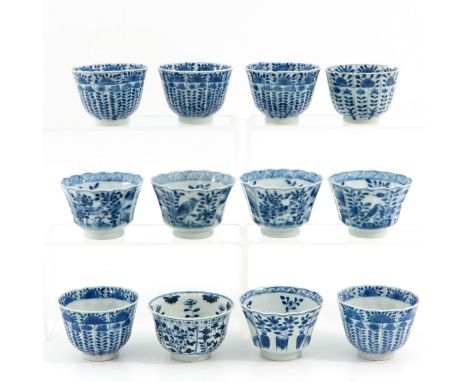 Blue and white decor, 8 cm. in diameter, including Kangxi mark, chip and hairine.