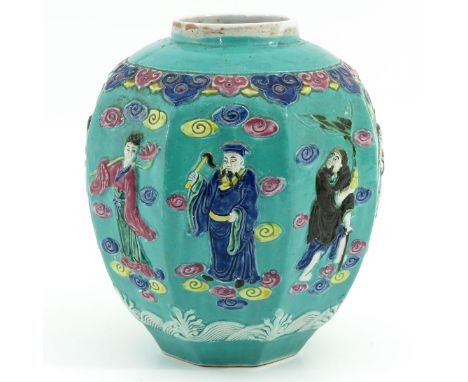 Light green ground with Famille Rose enamels, decorated with Chinese figures, 22 cm. tall. 