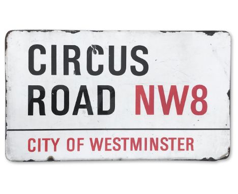 An enamelled iron street sign for Circus Road NW2, City of Westminster with iconic black and red sans serif lettering first c