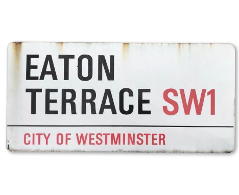 An enamelled iron street sign for Eaton Terrace SW1, City of Westminster, with iconic and black and red sans serif lettering 