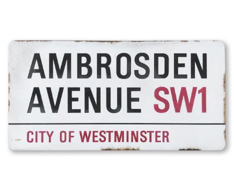An enamelled iron street sign for Ambrosden Avenue SW1, City of Westminster, with iconic and black and red sans serif letteri