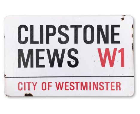 An enamelled iron street sign for Clipstone Mews W1, City of Westminster, with iconic black and red sans serif lettering firs