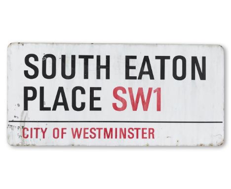 An enamelled iron street sign for South Eaton Place SW1, City of Westminster, with iconic and black and red sans serif letter