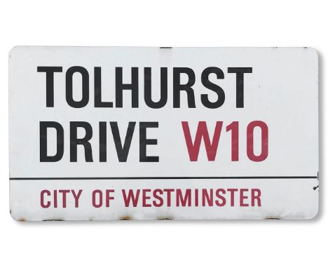 An enamelled iron street sign for Tolhurst Drive W10, City of Westminster, with iconic and black and red sans serif lettering