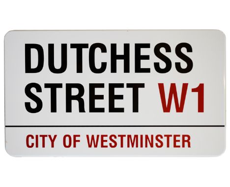 An enamelled iron street sign for Dutchess Street W1, City of Westminster, with iconic and black and red sans serif lettering