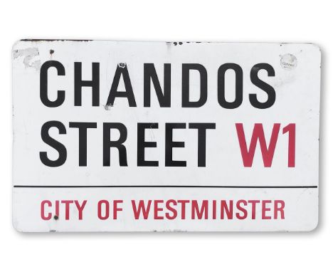 An enamelled iron street sign for Chandos Street W1, City of Westminster, with iconic and black and red sans serif lettering 