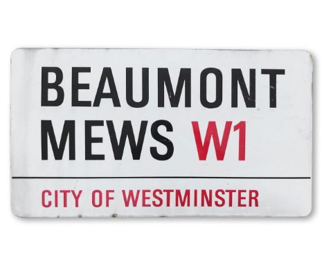 An enamelled iron street sign for Beaumont Mews W1, City of Westminster, with iconic and black and red sans serif lettering f