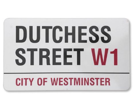 An enamelled iron street sign for Dutchess Street W1, City of Westminster, with iconic and black and red sans serif lettering