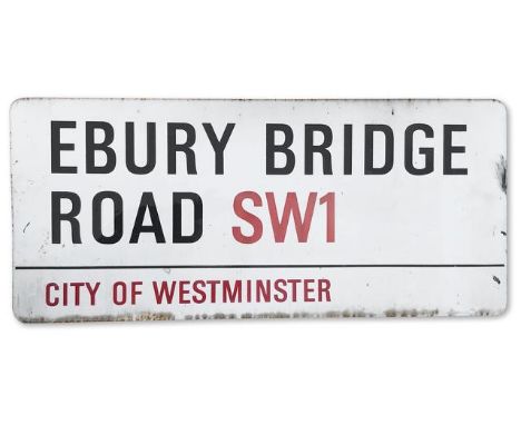 An enamelled iron street sign for Ebury Bridge Road SW1, City of Westminster with iconic black and red sans serif lettering f